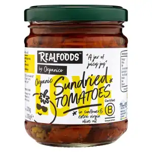 Organic sundried tomatoes in glass jar with label, ideal for gourmet cooking.